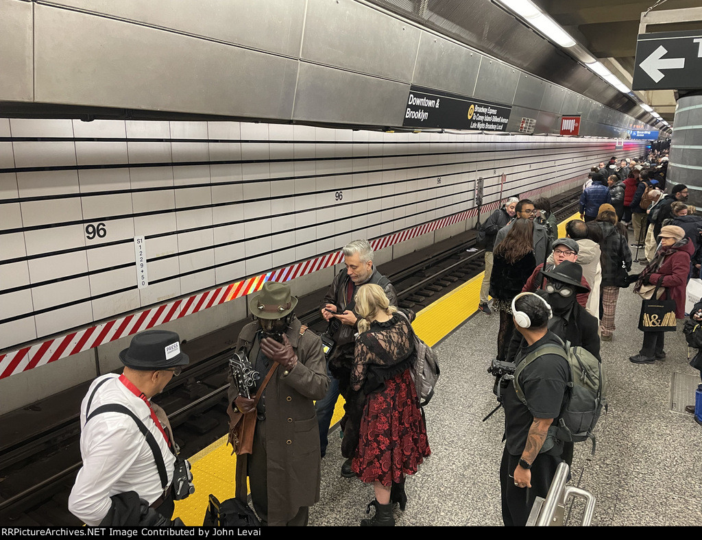 Passengers wait for the Holiday Arnine Set to pick them up at 96th St Station for the trip back to Midtown and the Lower East Side